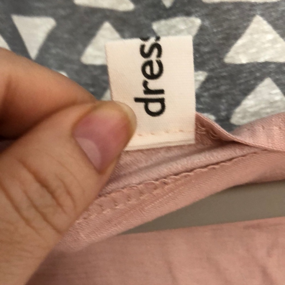Small sky blue pink color with buttons on the front it’s small size